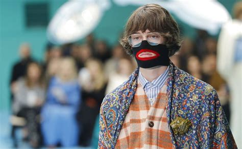 gucci pulled a black polo neck sweater|Gucci pulls polo neck after 'blackface' claims.